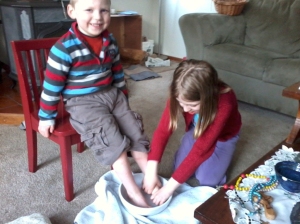 The Rice children participating in a foot-washing ritual at home, on Holy Thursday.