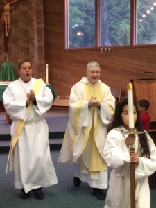 Deacon Mike Galbraith, left, assists at Mass at Holy Name in Ketchikan with Fr. Pat Travers.
